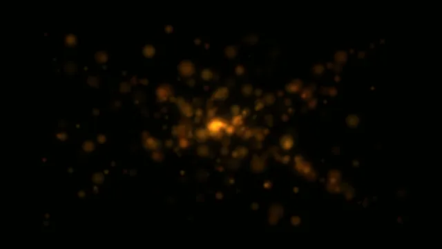 4K golden particle explosion loop with dark background
