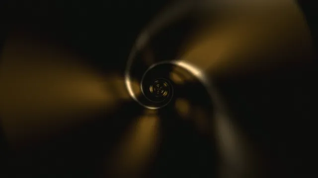 4K rotating metallic sphere with golden light reflections