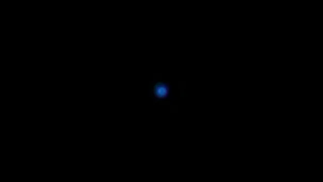 Blue Glowing Orb on Black Background Abstract