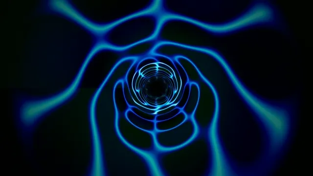 Bright blue waves flow through dark tunnel during night time