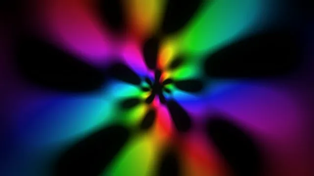 Colorful light patterns swirl in dark background
