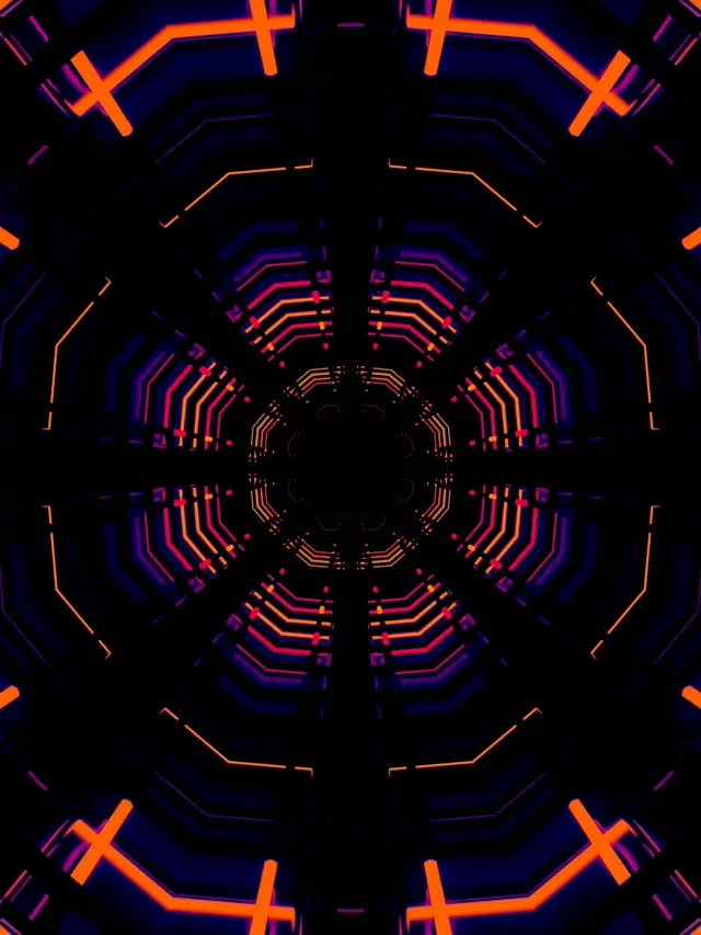 Sümmeetriline neon tunnel konsentriliste kaheksanurkade vooluringidega elava oranži, roosa ja sinise neoni joontega. Abstraktne VJ silmusega liikumise tausta.
